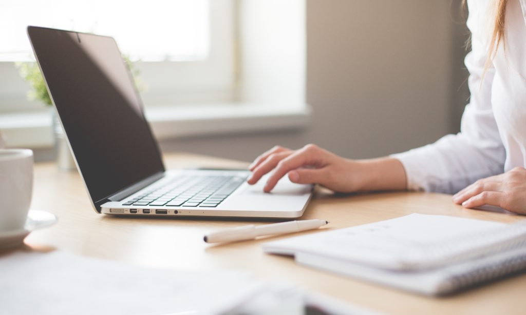 photo of a nursing student with a laptop computer