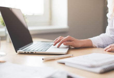 photo of a nursing student with a laptop computer