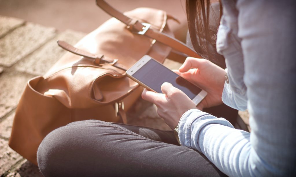 photo of a nurse practitioner using a smartphone