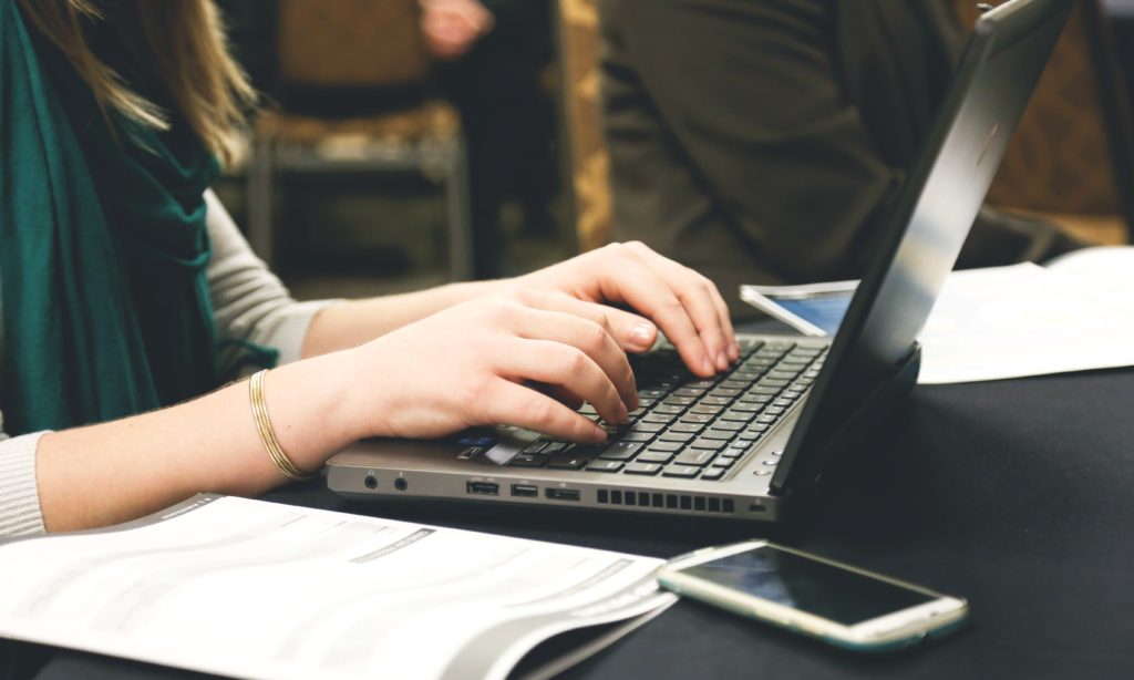 Photo of a nursing student using a laptop computer