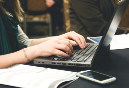 Photo of a nursing student using a laptop computer