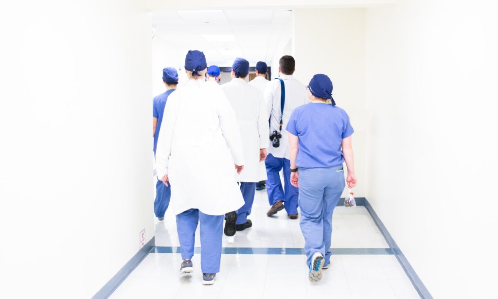 Photo of a group of Nurse Practitioners in a hospital hallway