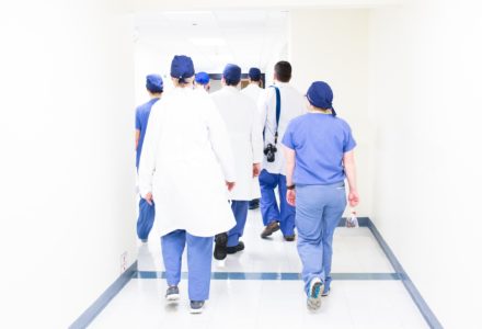 Photo of a group of Nurse Practitioners in a hospital hallway