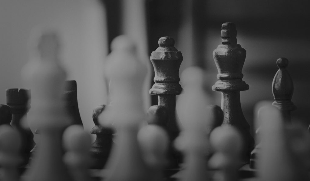 Closeup black and white photo of a chess board