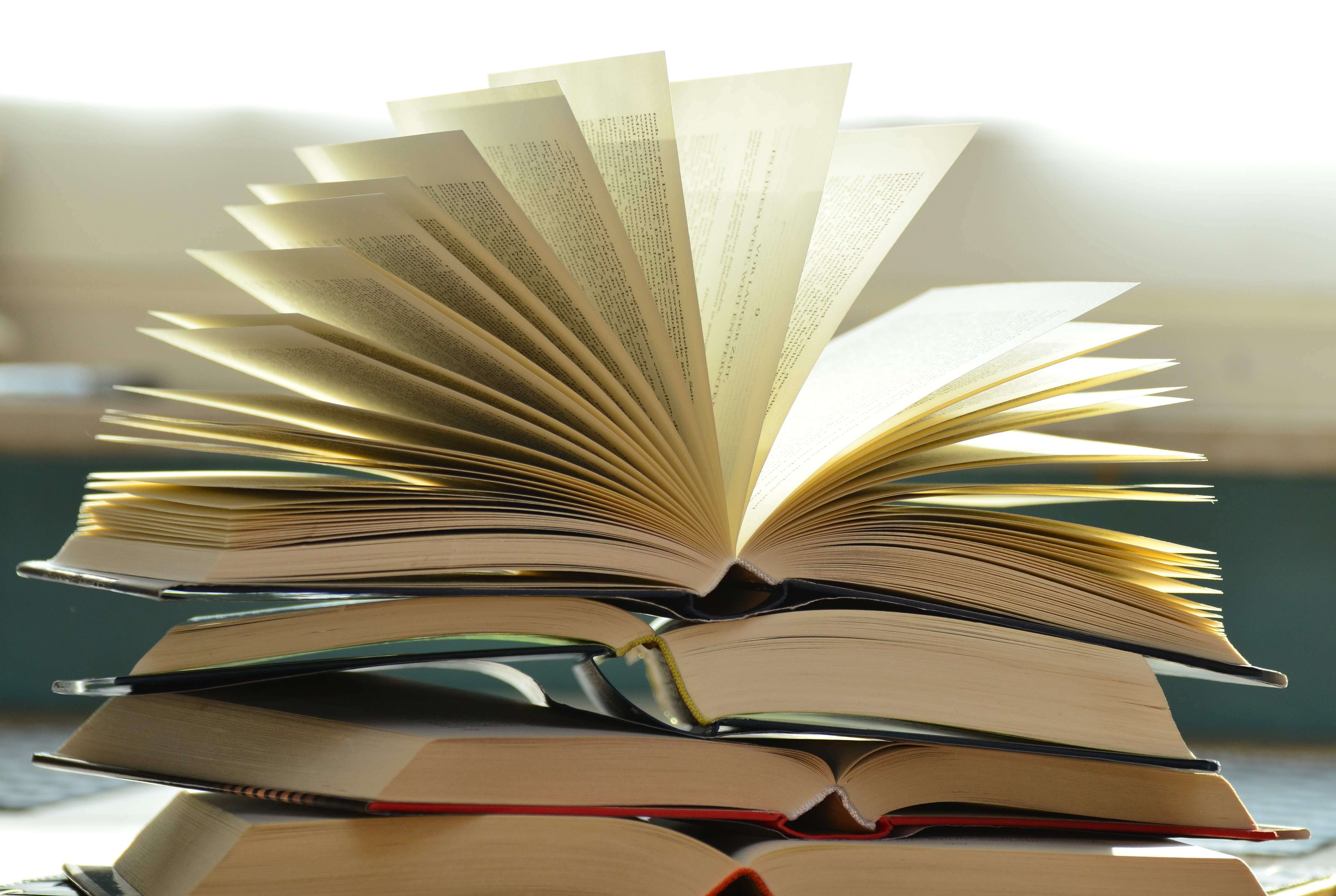 Photo of a stack of books owned by a nurse practitioner