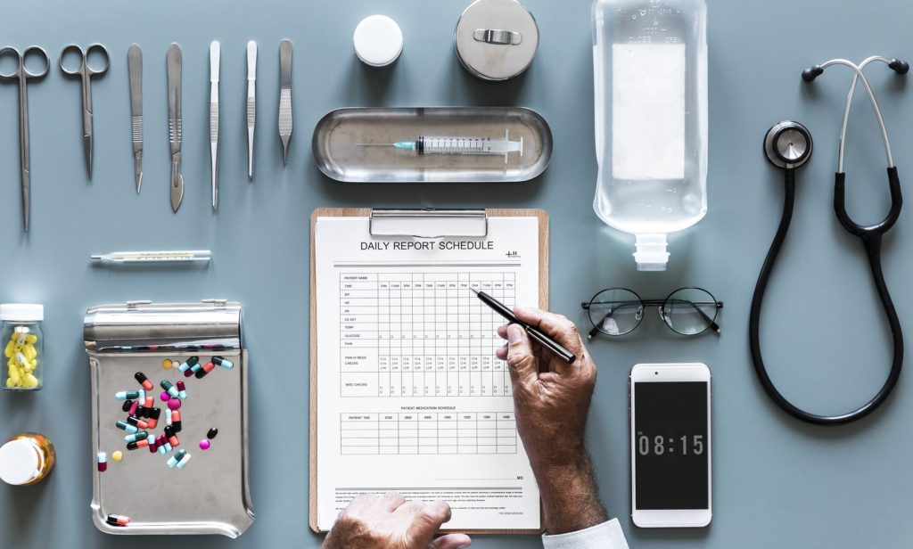 Photo of a nurse practitioner filling out paperwork at their desk