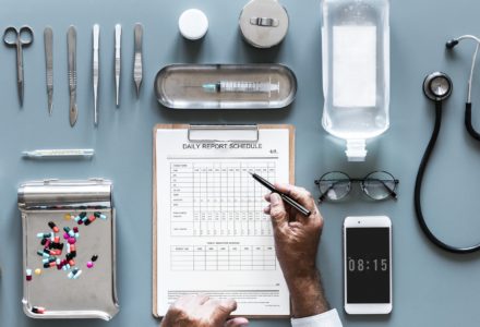 Photo of a nurse practitioner filling out paperwork at their desk