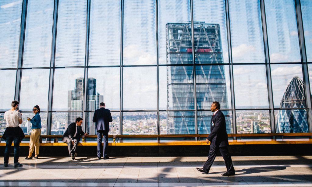 photo of a group of people in a high rise building