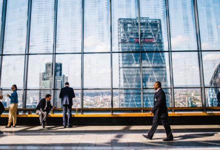 photo of a group of people in a high rise building