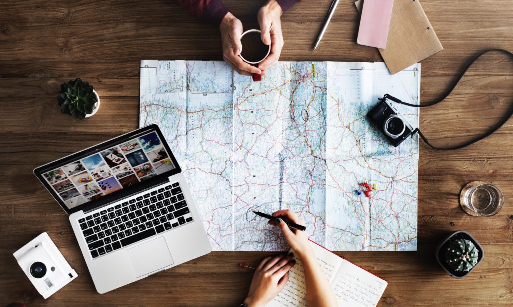 Photo of two nurse practitioners examining a map