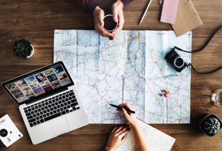 Photo of two nurse practitioners examining a map