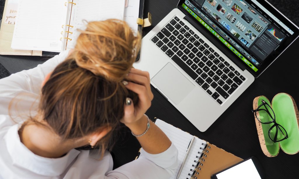 Photo of a nurse practitioner student studying on a laptop computer