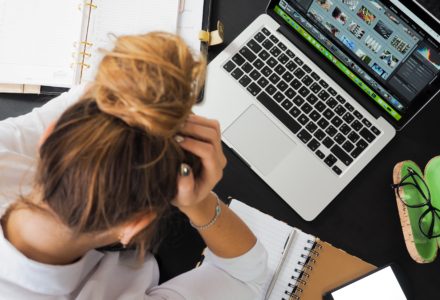 Photo of a nurse practitioner student studying on a laptop computer