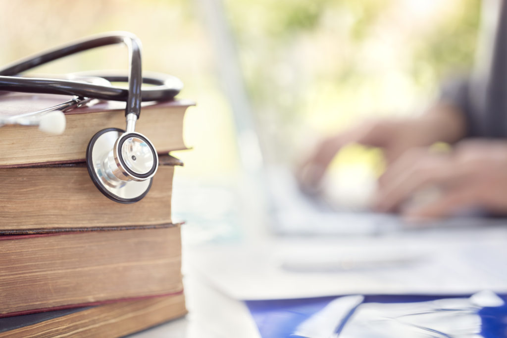 Stack of Nurse Practitioner Guideline Books